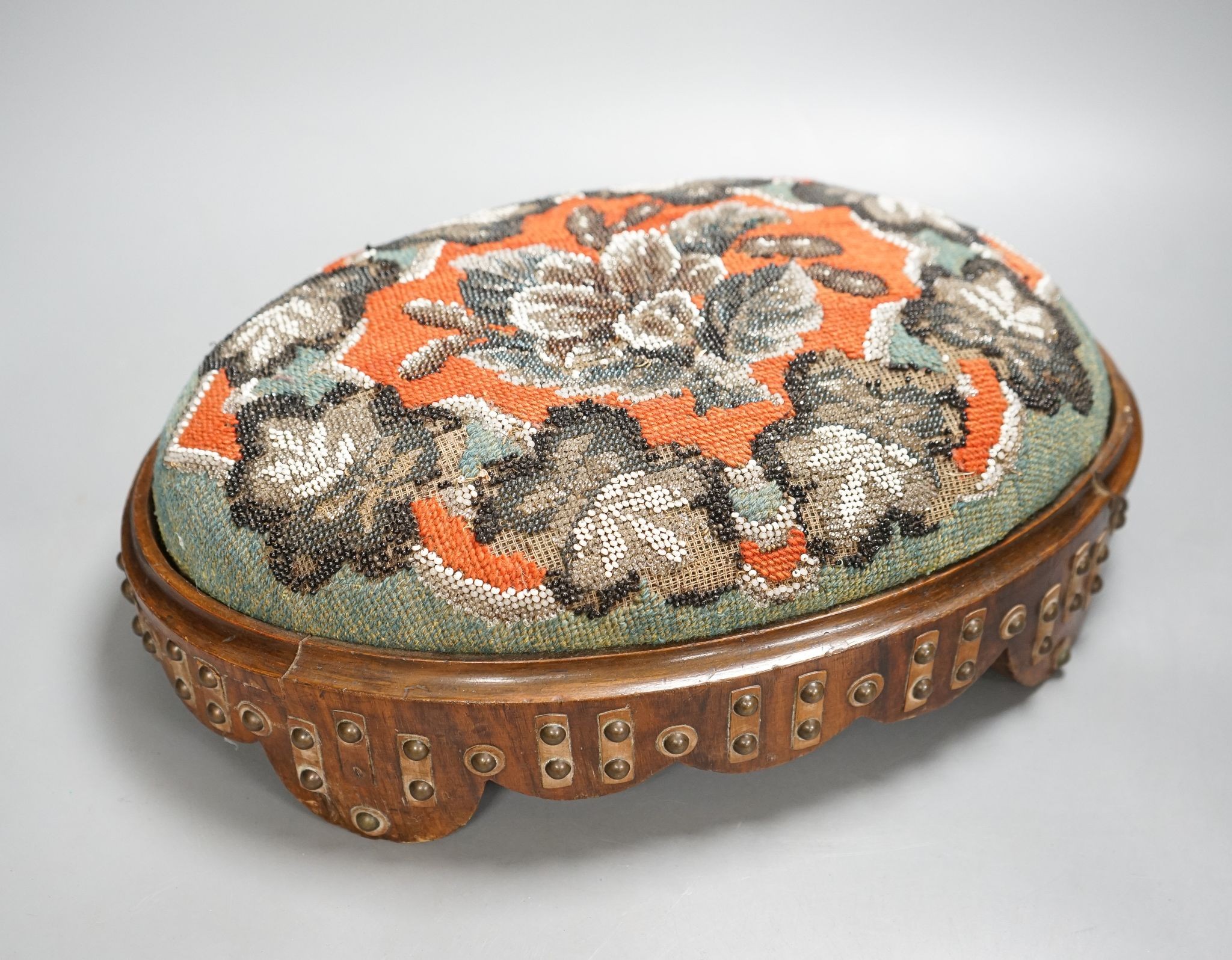 A pair of Berlin beadwork footstools, 38cm